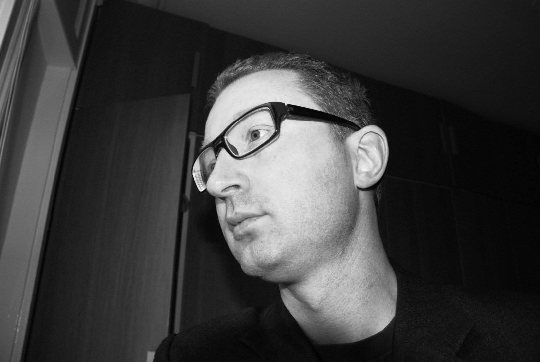 Black and white portrait of Peter Ferretto, an architect and lecturer based in London.