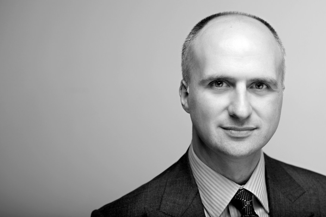 Black and white portrait photograph of Aaron Renn, urban affairs analyst.