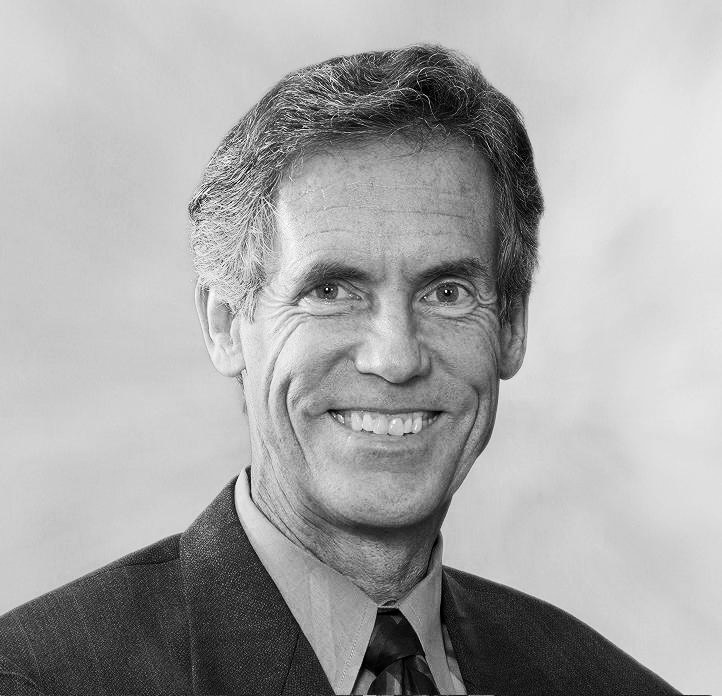 Black and white portrait photograph of Bruce Hamilton, Director of Navigant's Energy Practice.