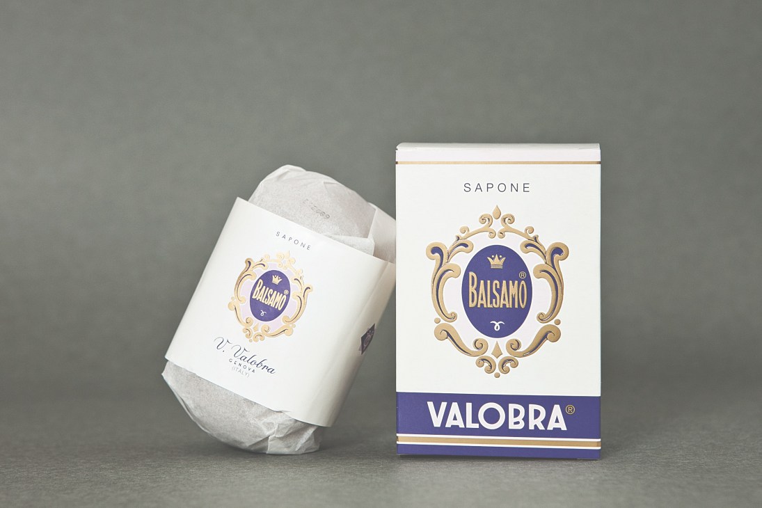 Valobra soap bar and packaging with Art Deco logo design in white and blue.