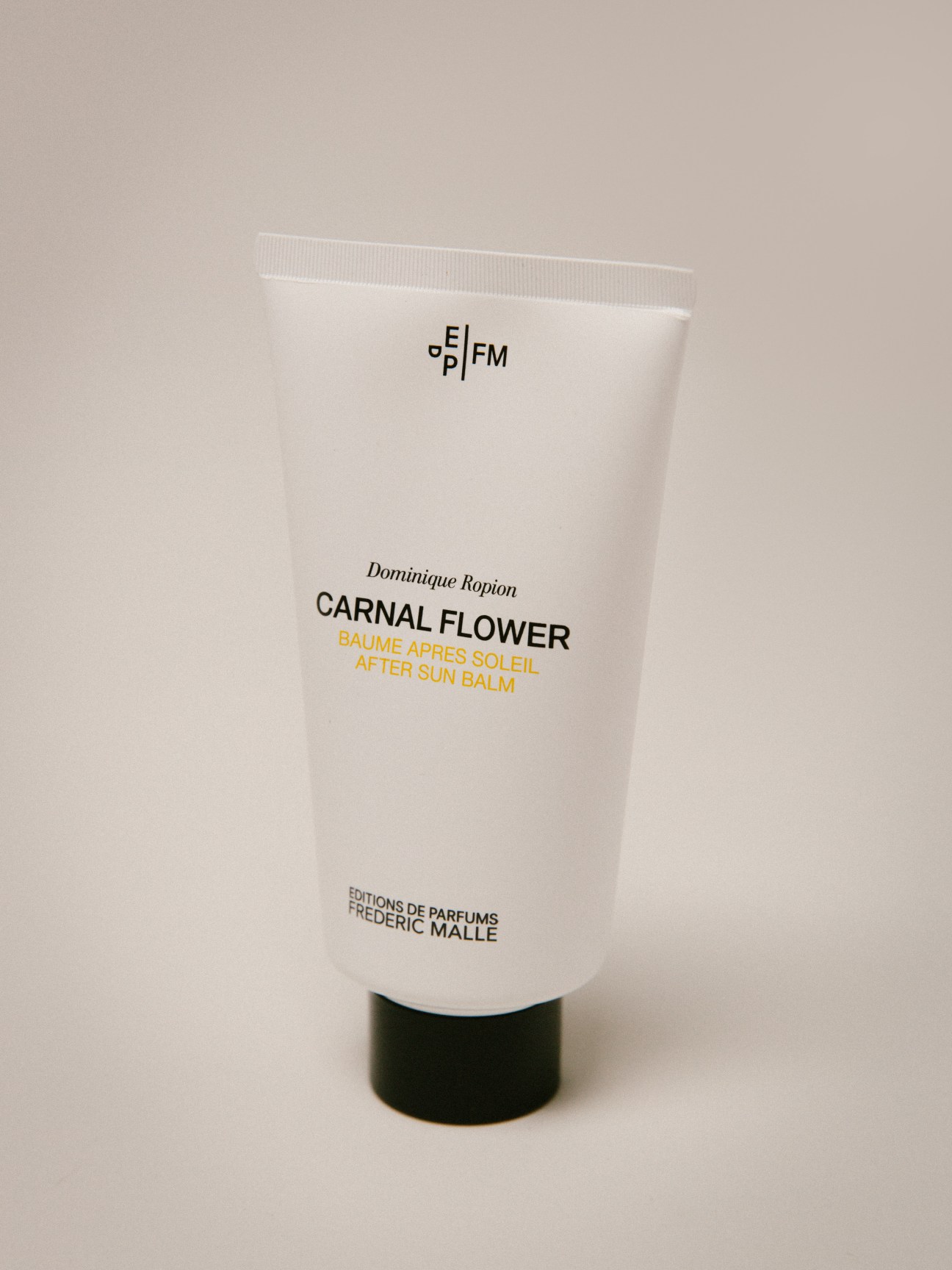 Frederic Malle Carnal Flower after-sun balm by Dominique Ropion in white tube with black cap