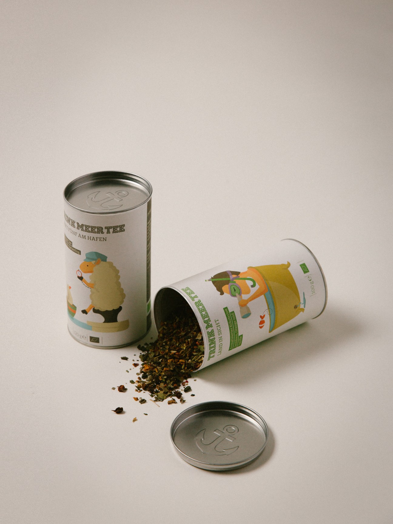 Trink Meer Tee tea packaging with playful illustrations showing German coastal ingredients spilling from an open tin.