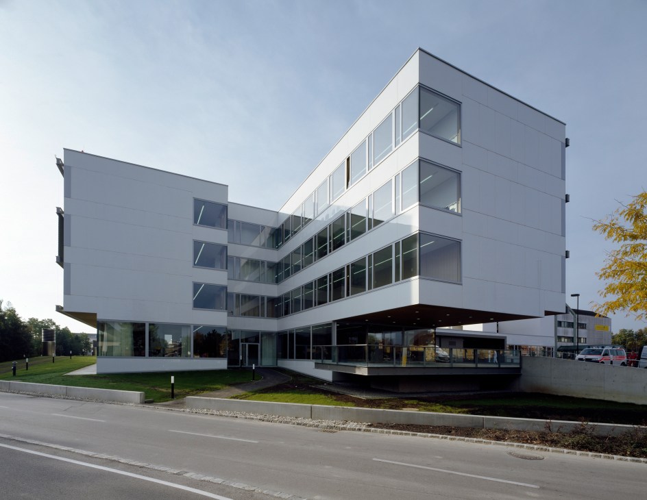 The Danube Clinic in Tulln, Austria, with white glass exterior and multiple floor-to-ceiling windows.