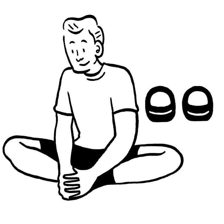 Line drawing illustration of a person sitting cross-legged with kettlebells nearby.