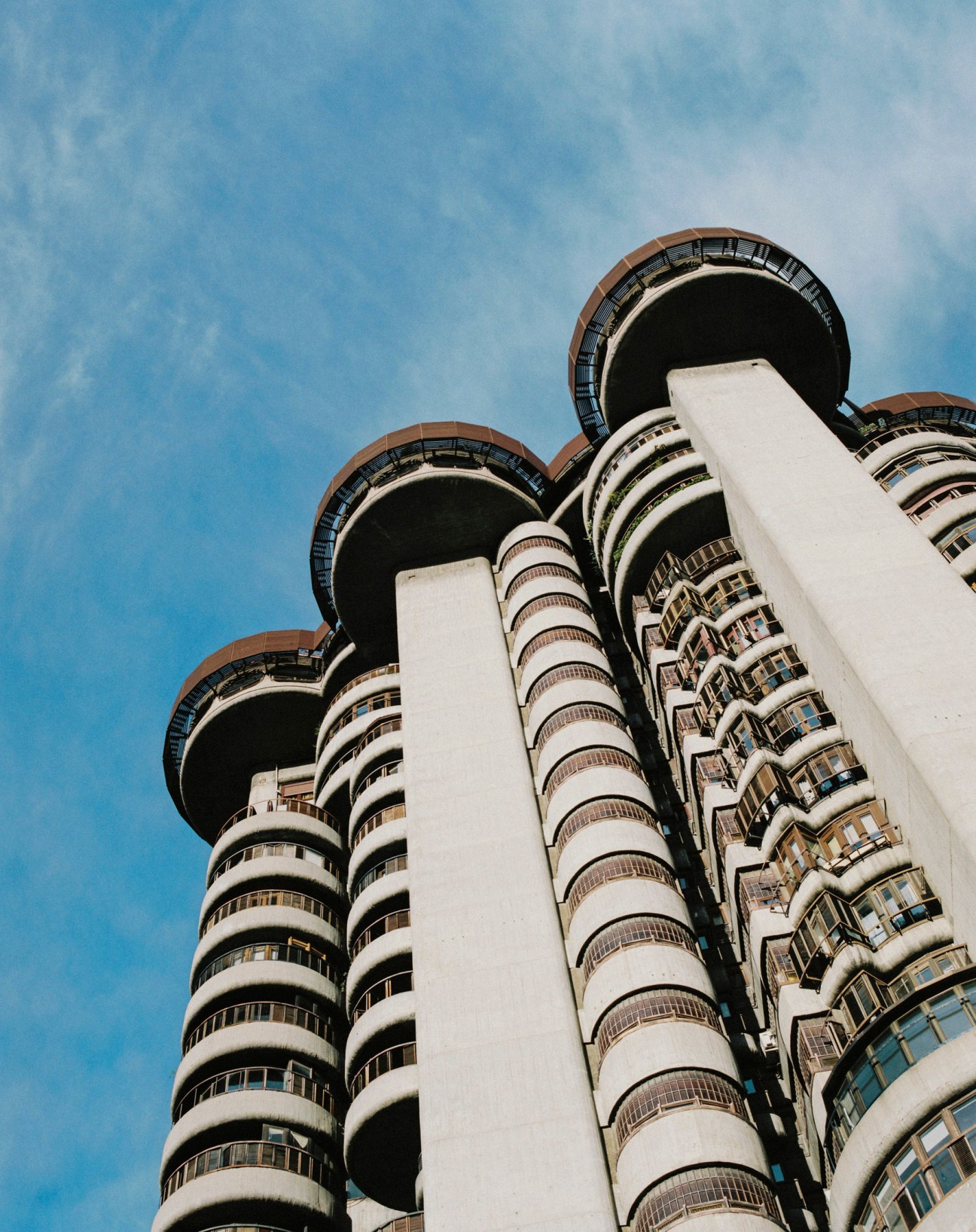 Torre Blancas modernist residential towers photographed from below against a clear blue sky.