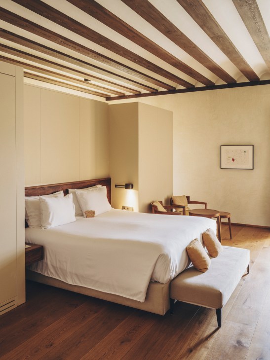 Hotel guest room interior featuring neutral color palette and contemporary design