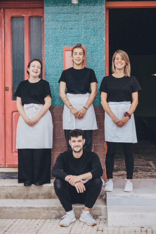 Group portrait of young Galician waiting staff standing together at Bar do Porto