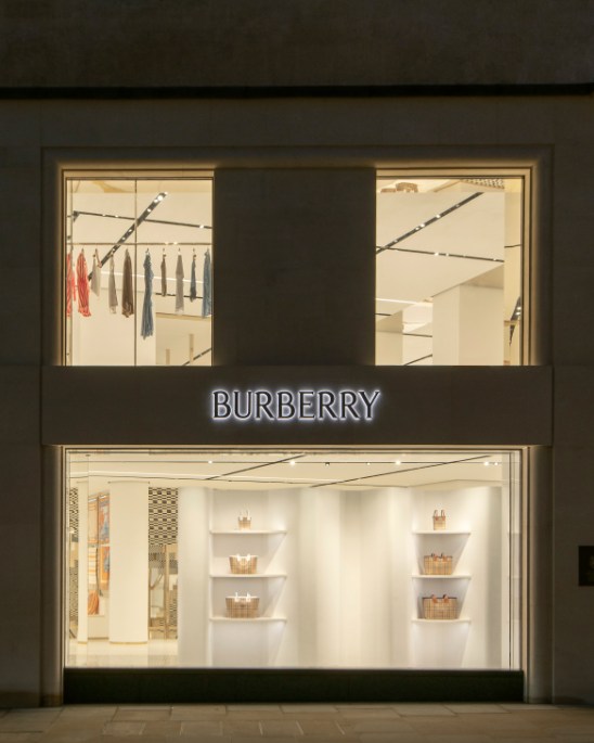 Burberry forest-green car coat displaying loose silhouette and classic British tailoring