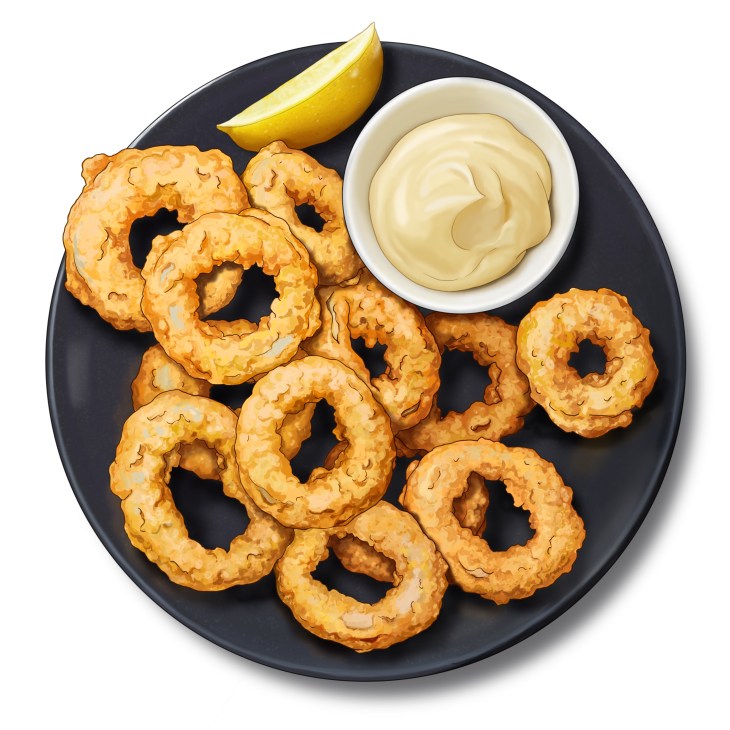 Golden fried squid rings on a dark plate with creamy aioli dipping sauce and a lemon wedge
