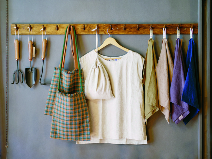 Display of functional homeware items including ceramics and textiles at Vicolo Via Mameli