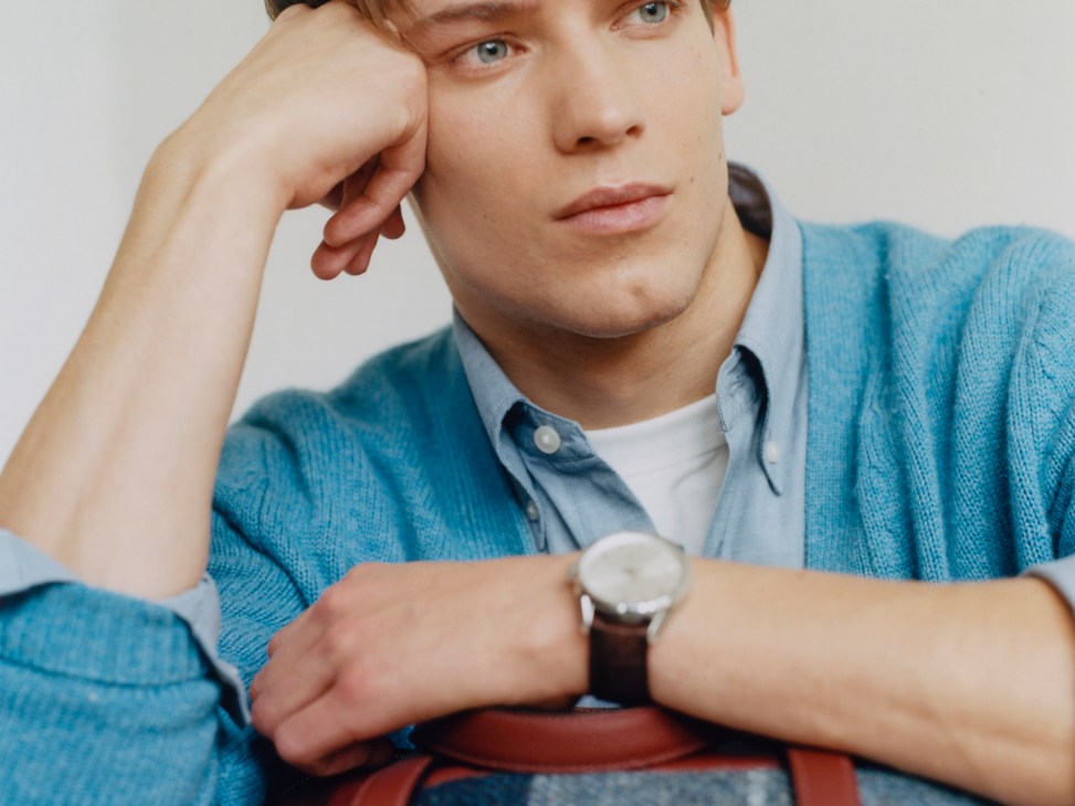 Model wearing jumper by Fursac, shirt and t-shirt by Uniqlo, with bag by Hermès and watch by Tag Heuer