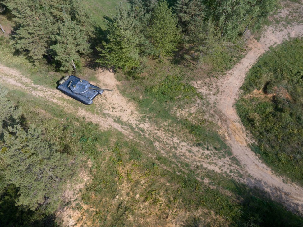 Inflatable military decoy tank in testing field