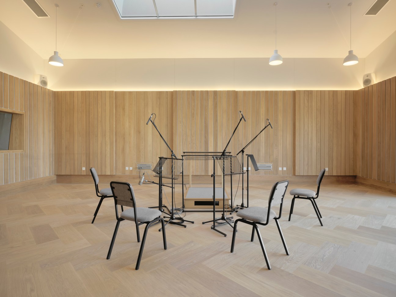 Multiple microphones arranged and positioned for recording a small musical ensemble