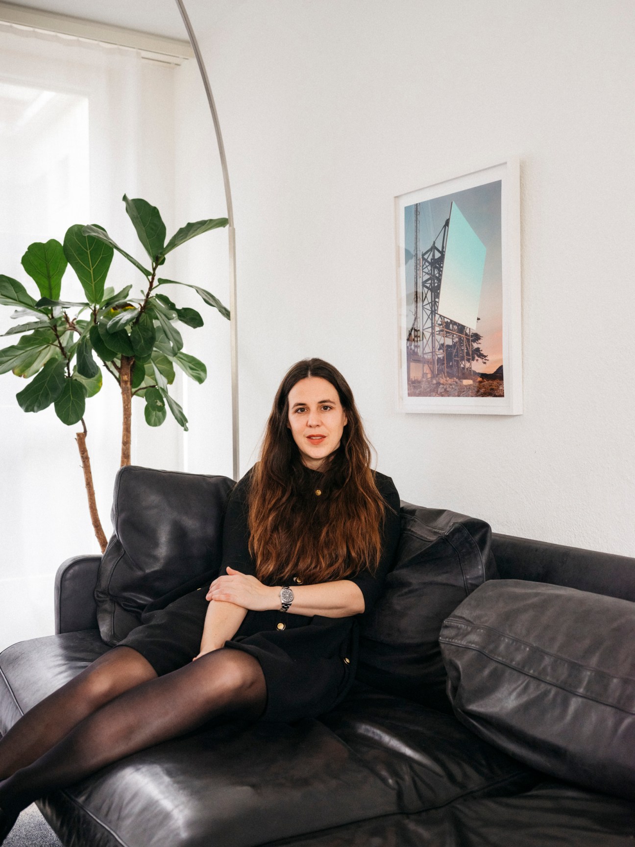 a young woman sitting on a sofa