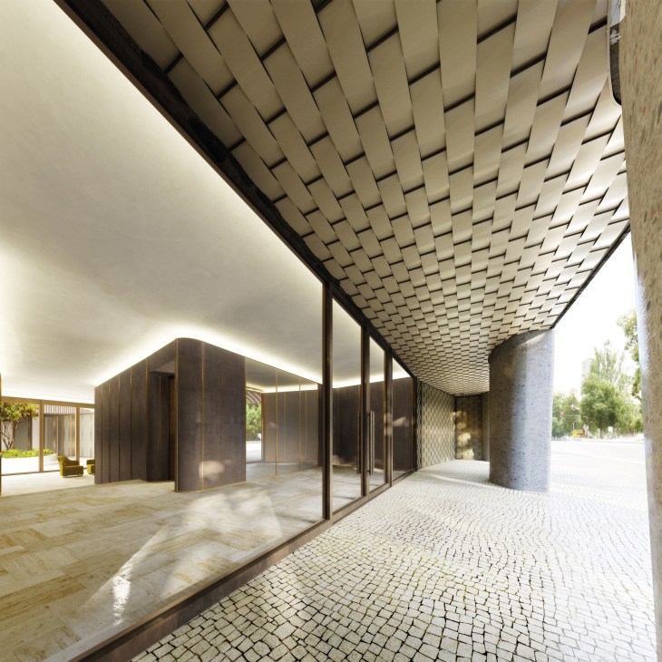 Modern architectural courtyard with geometric wooden ceiling, glass doors, and patterned stone flooring.