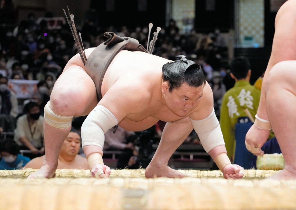 Hakuho Sho performing a sumo wrestling move during a match
