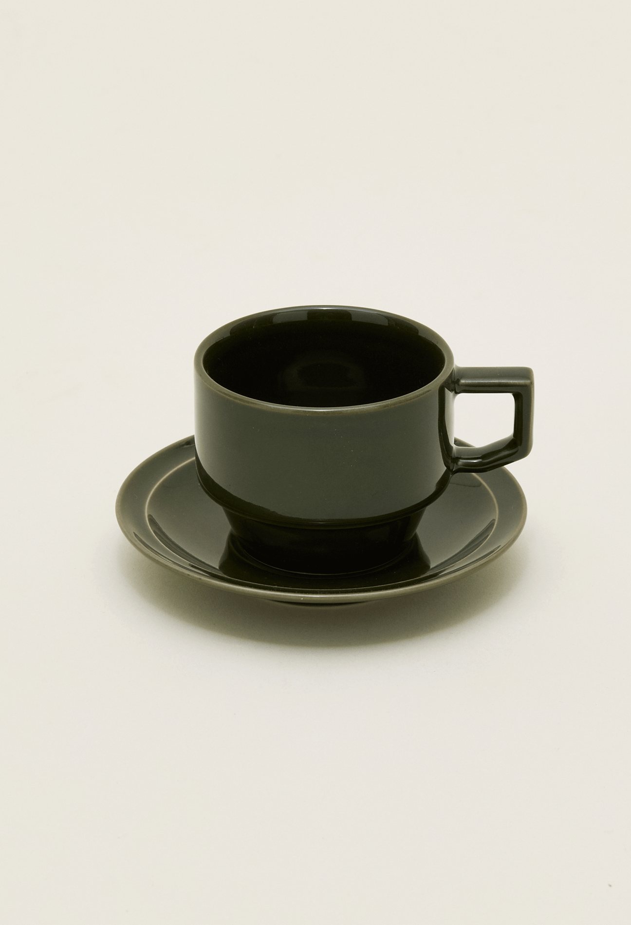 Dark olive green ceramic coffee cup and saucer set with modern minimalist design
