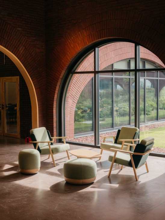Wooden chair positioned by a window with natural sunlight streaming in