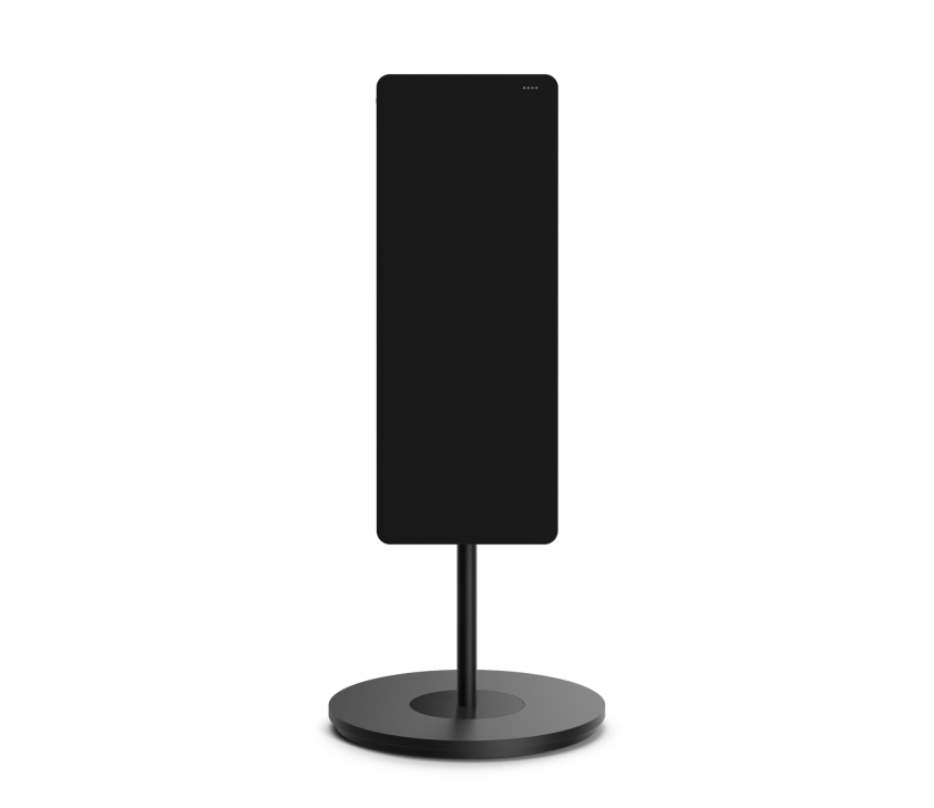 Black cylindrical speaker on round base stand against white background