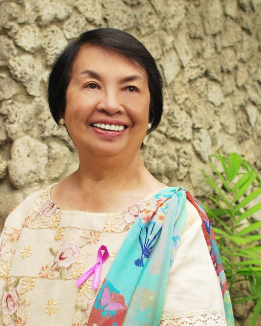 Portrait of Irene Santiago, elderly Filipino woman in professional attire