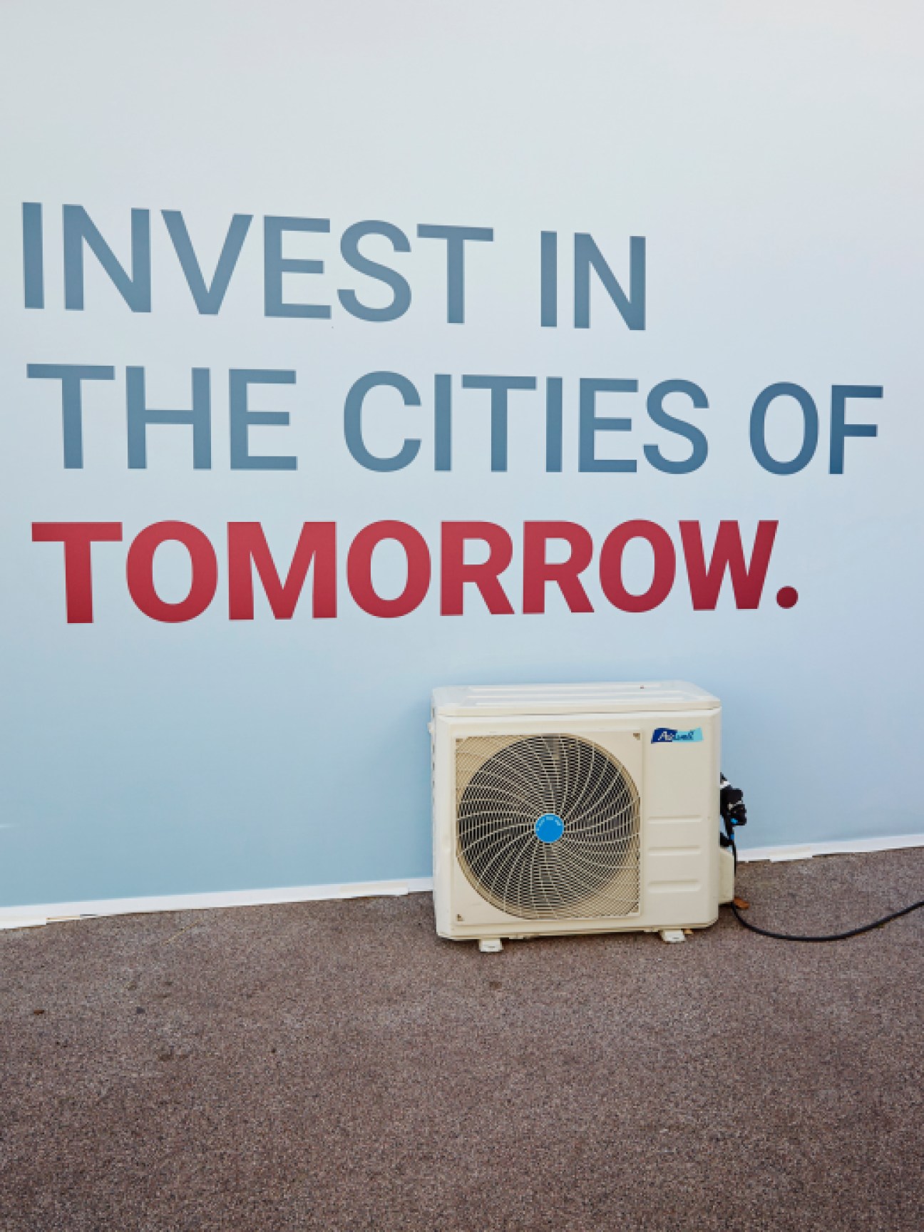 Close-up of an industrial air conditioning unit displayed at Mipim exhibition, showing technical infrastructure equipment