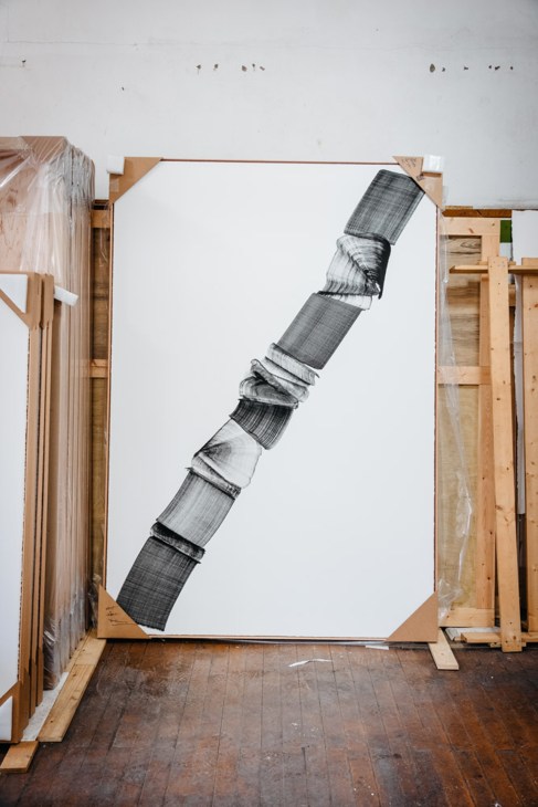 Artist Lee Bae working with charcoal materials in his Cheongdo studio