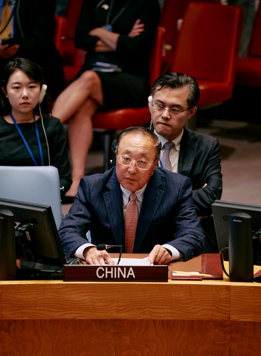 Chinese Ambassador Zhang Jun seated at his desk during a UN Security Council session