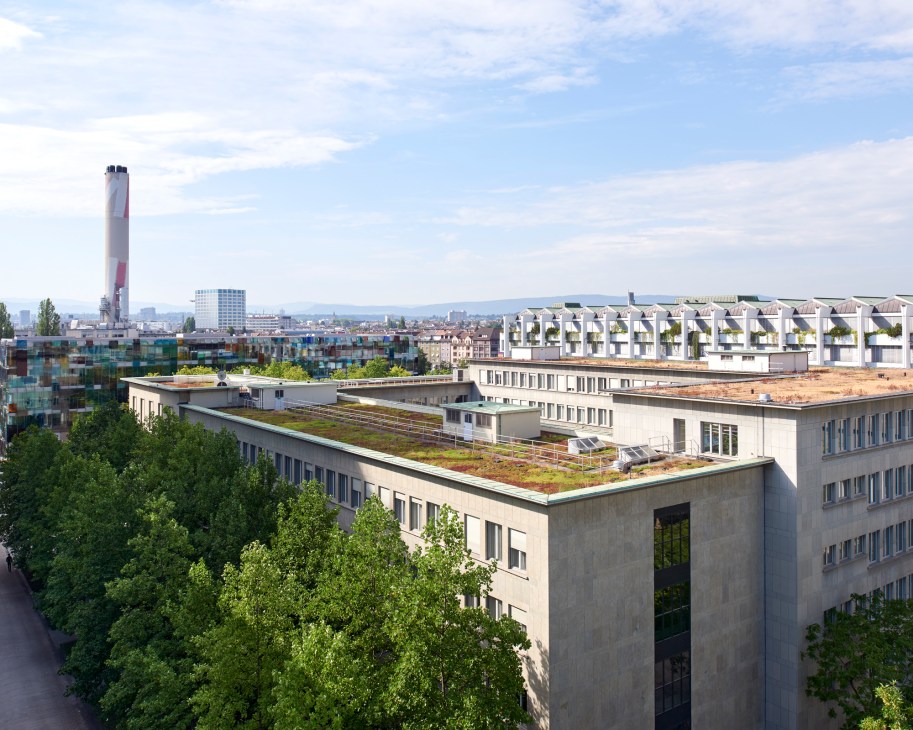 Aerial view of modern buildings with green rooftops and landscaping on the Novartis campus in Basel