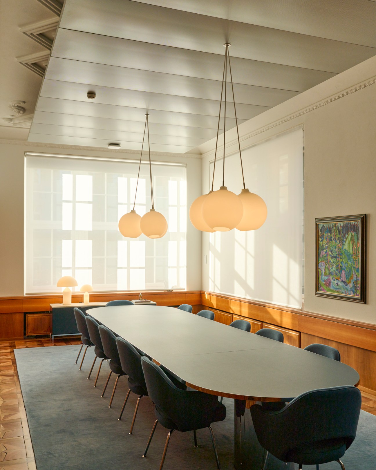 Hermann Scherer's 'Waldlandschaft' painting hanging on the wall of a meeting room