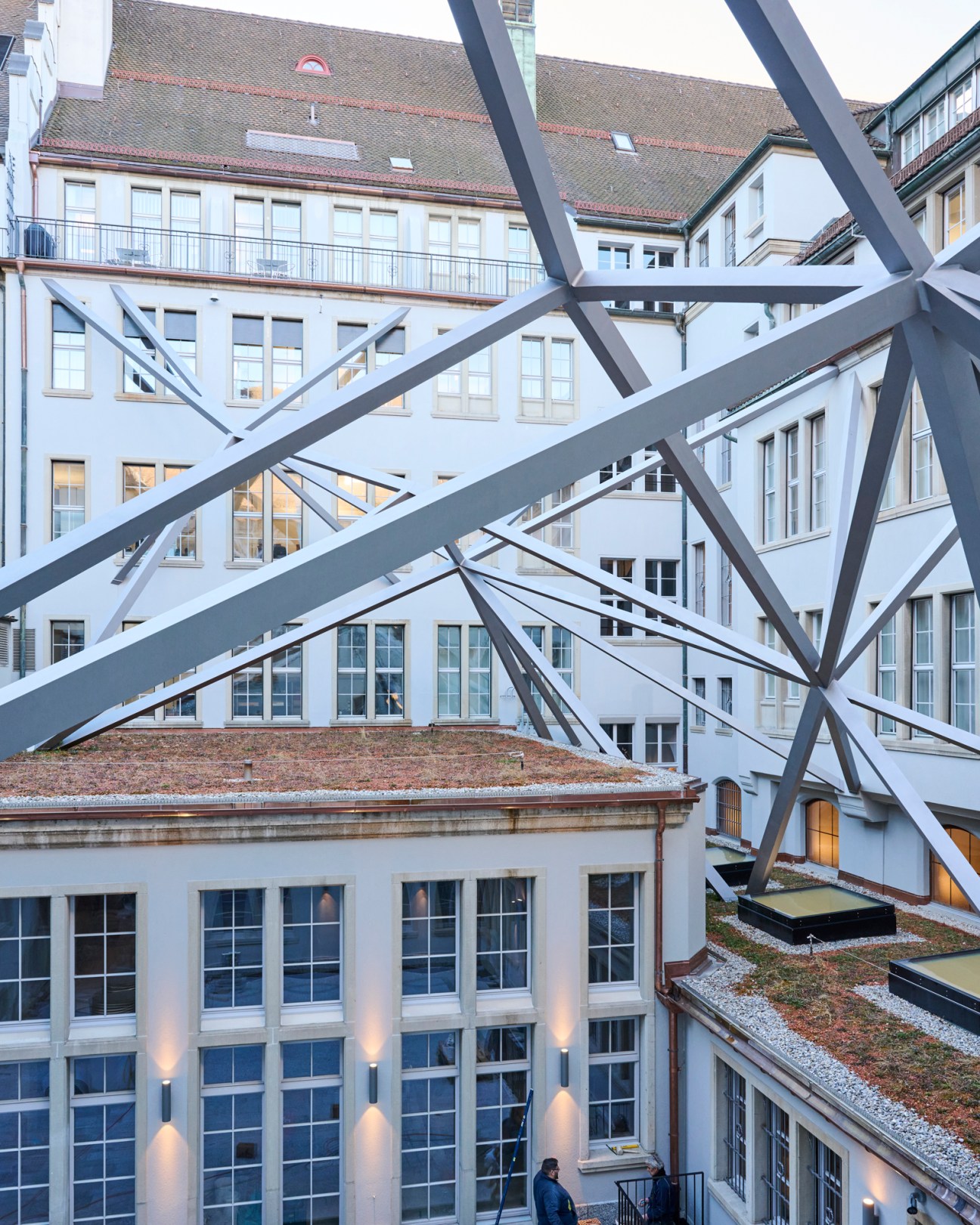 Tilla Theus's elaborate steel structure spanning across a building courtyard