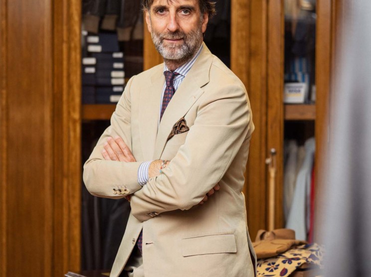 Andrea Luparelli, founder of Sartoria Ripense, wearing a tailored beige suit in his Rome atelier.