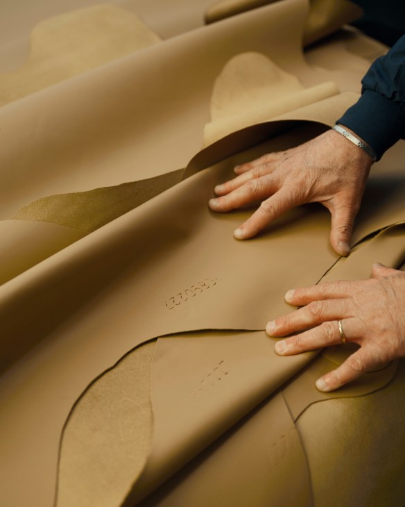 Craftsman working on leather in Poltrona Frau's sustainable tanning process without chromium