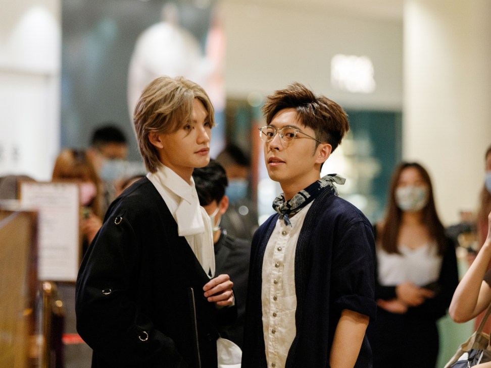 Two young men from Hong Kong boy band Mirror at a shopping mall promotional event