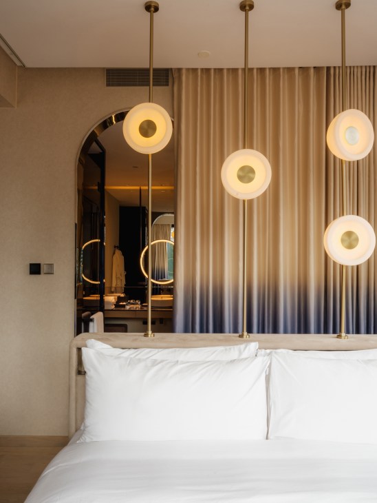 Modern guest room interior at the Mondrian Singapore Duxton with ambient lighting