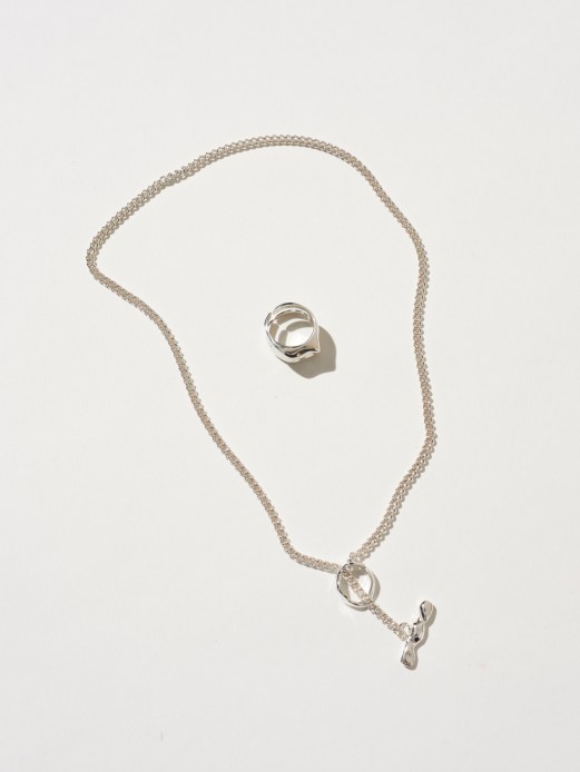 Minimalist silver jewellery pieces from Apiliotis showing stackable ring bands