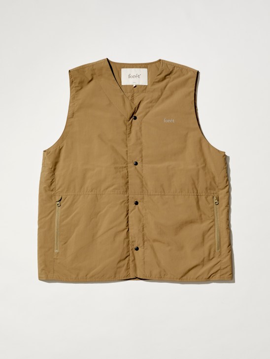 khaki sleeveless vest with snap buttons and zippered pockets from outdoor clothing brand Forét