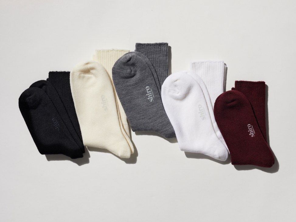 Close-up of Shiro merino wool socks in neutral colors showing fine Italian craftsmanship and sports-inspired design