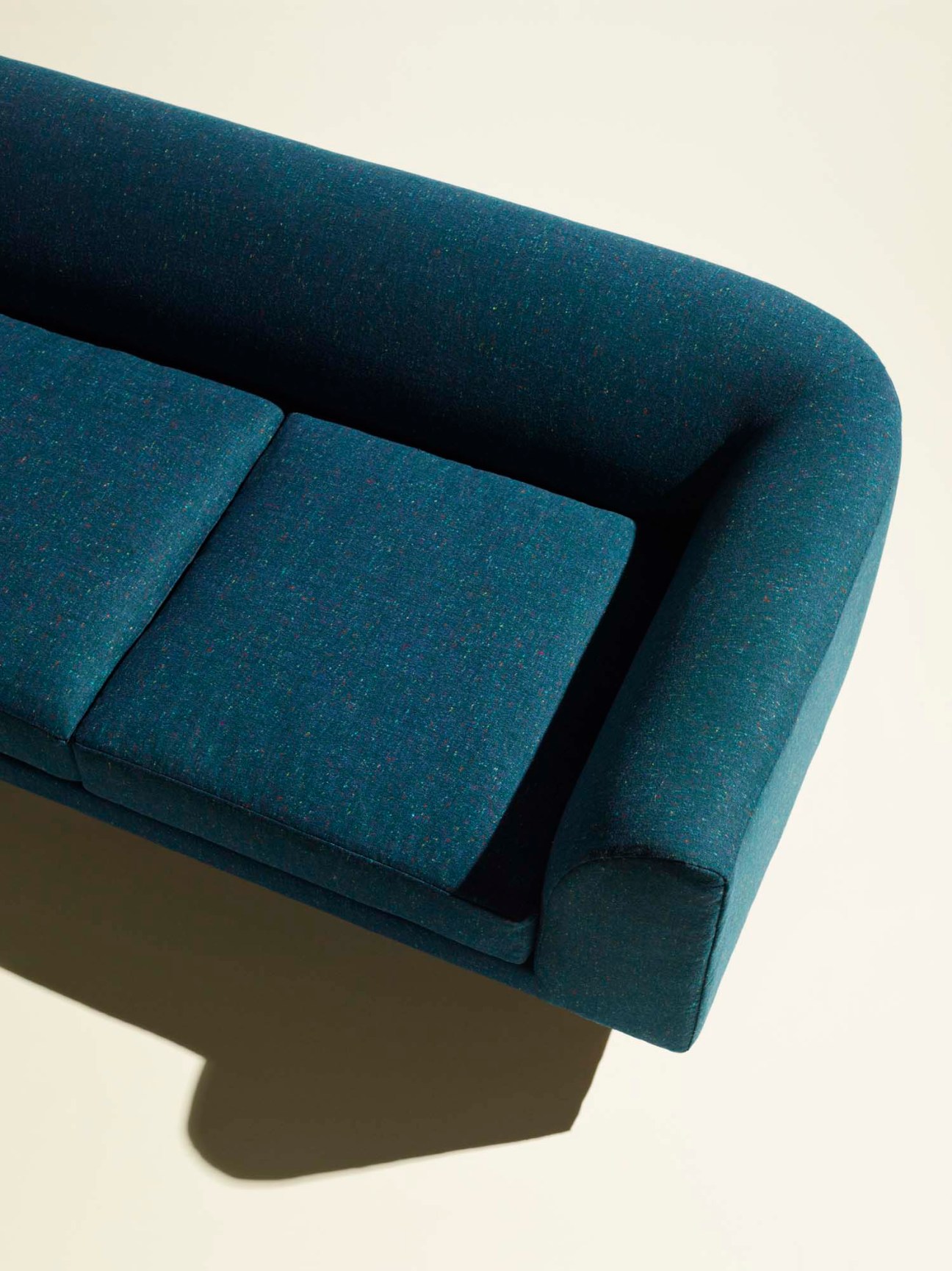 Woodgate three-seat sofa by Terence Woodgate in teal fabric with low-profile design and rounded arms