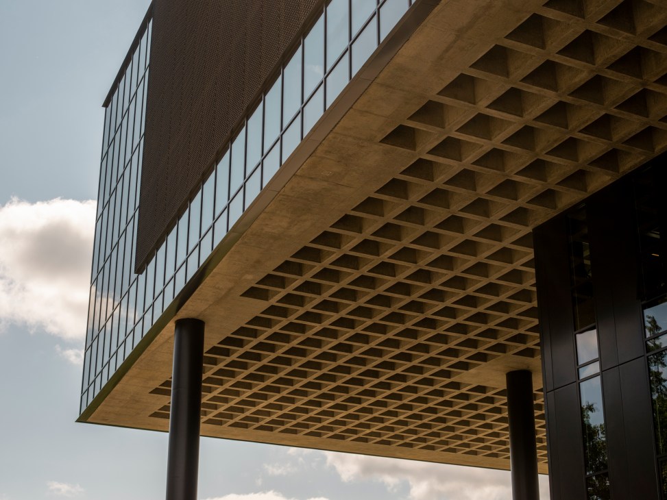 Modern building with geometric concrete overhang and glass facade at Nike headquarters