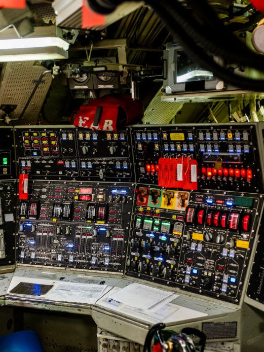 Submarine control center with multiple computer screens and control panels