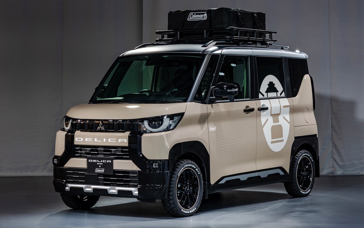 Mitsubishi Delica Mini compact van with Coleman camping gear and roof rack equipment