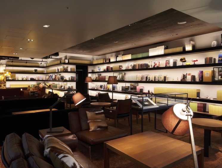 Dimmed lighting and dark-stained wood set the mood for the lounge