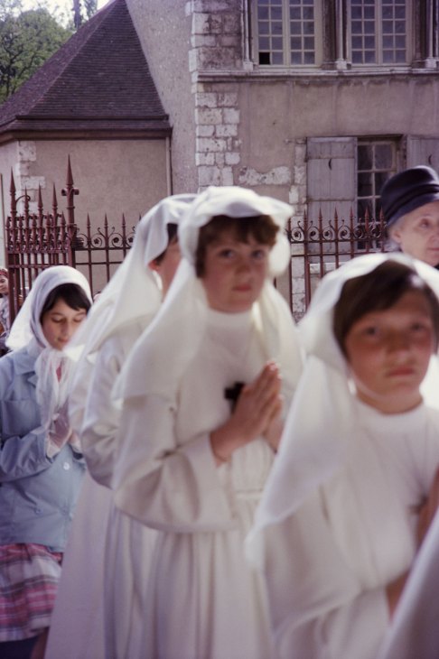 Nuns in black habits walking together on a street, showing religious devotion in daily life