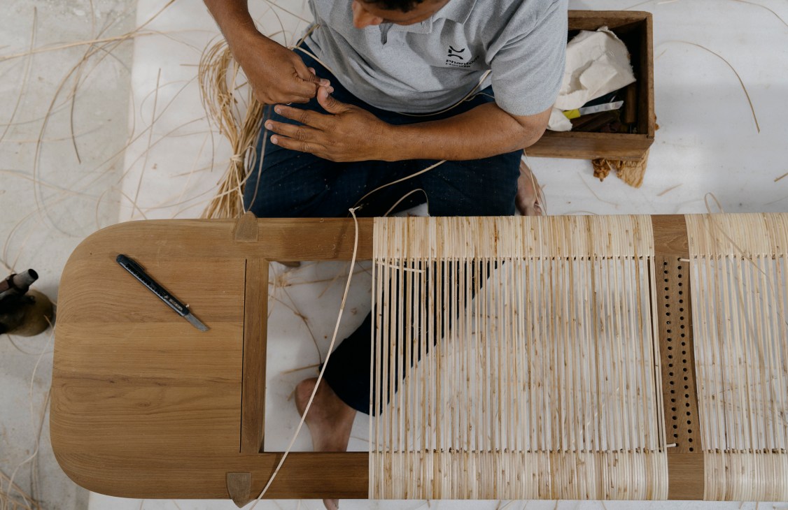 Portrait of Phantom Hands founder Deepak Srinath in workshop setting