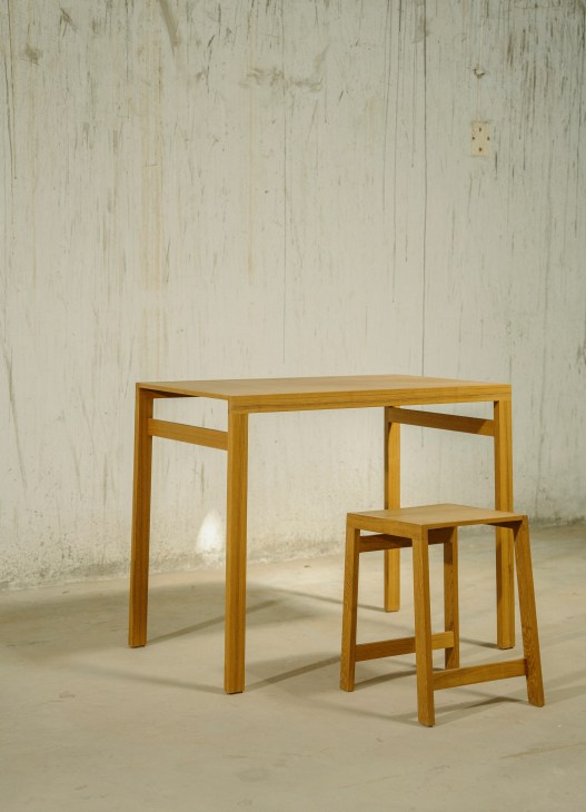 Detailed woodworking process on modernist chair frame