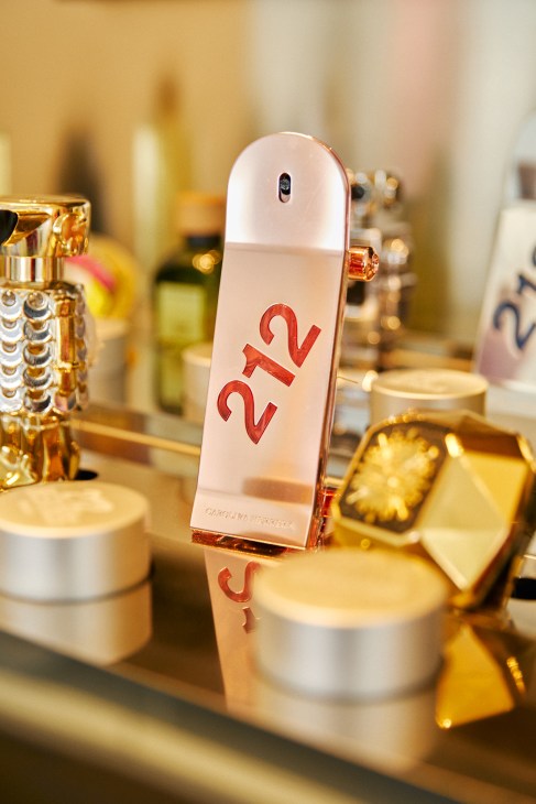 A collection of various Puig-owned fragrance bottles arranged together