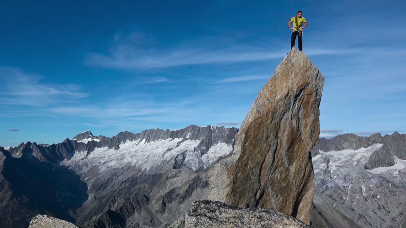 Mountain climbers scaling a steep snowy peak, from the documentary Race to the Summit