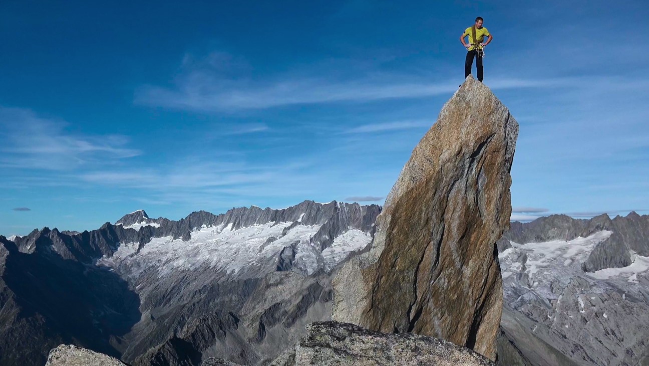 Mountain climbers scaling a steep snowy peak, from the documentary Race to the Summit