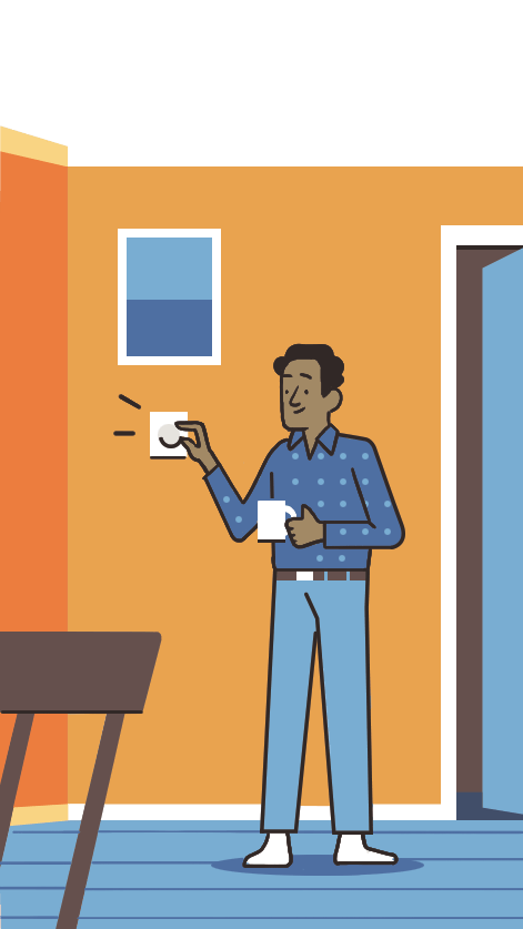 Man in blue sweater holding coffee cup and adjusting wall-mounted dimmer switch in orange room