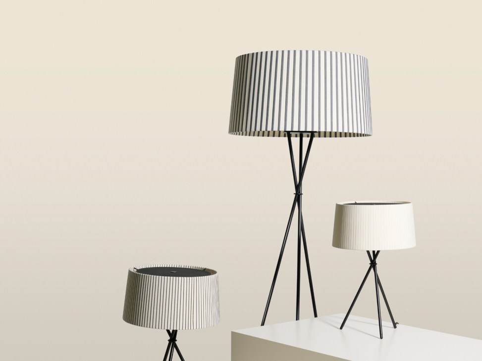 Three Santa & Cole Trípode lamps with black tripod legs and striped fabric lampshades in different sizes